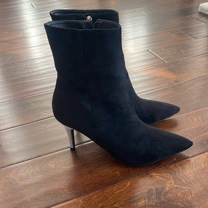 Black velour mini boots with silver heels.